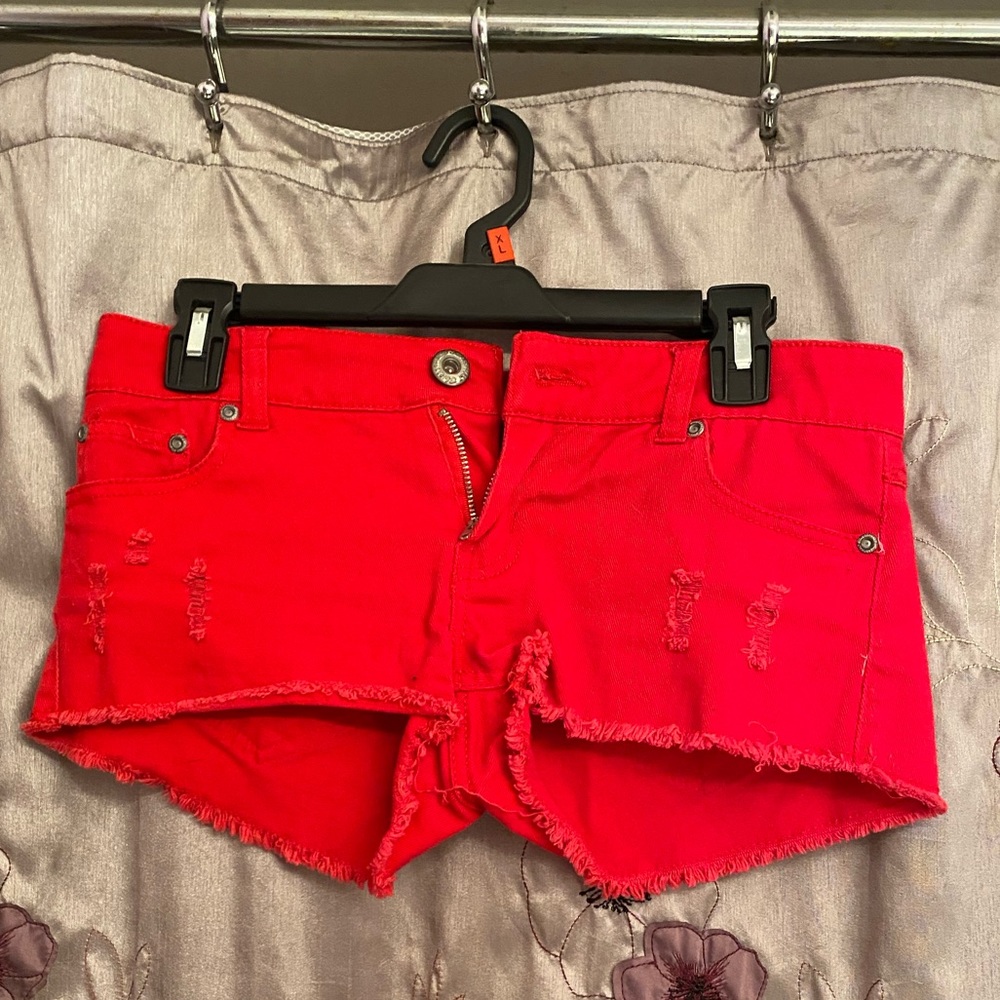 Ripped red shorts